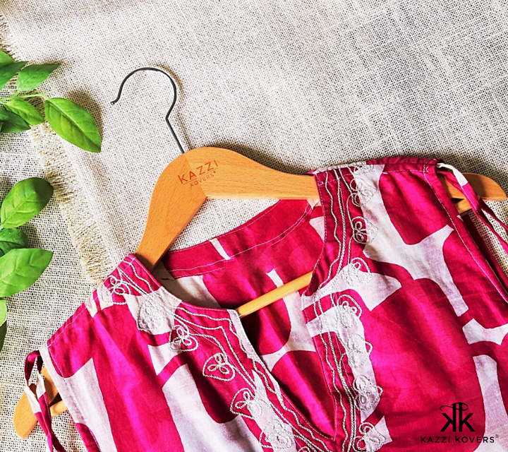 Kazzi Kovers lightweight clothing hanger with pink and white kaftan