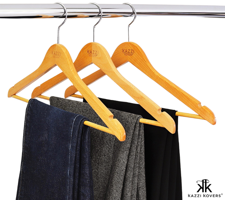 Jeans and pants hanging on Kazzi Kovers wooden clothes hanger with bar