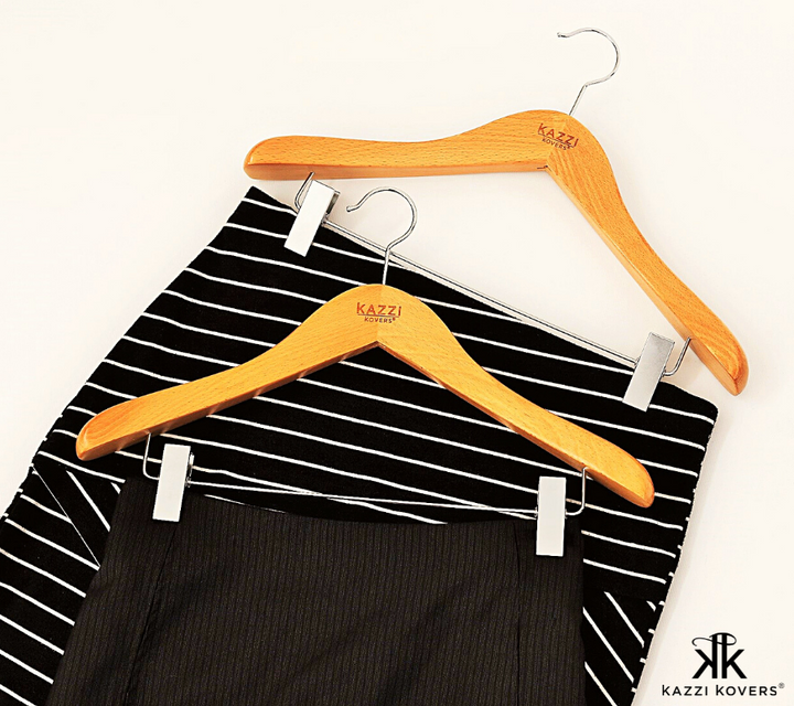 Skirt hanger with adjustable metal clips