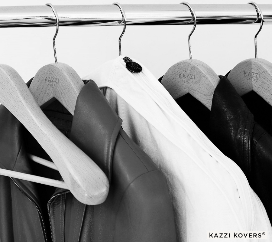 Cream clothes bag for leather jackets, and blazers organised neatly on a rack