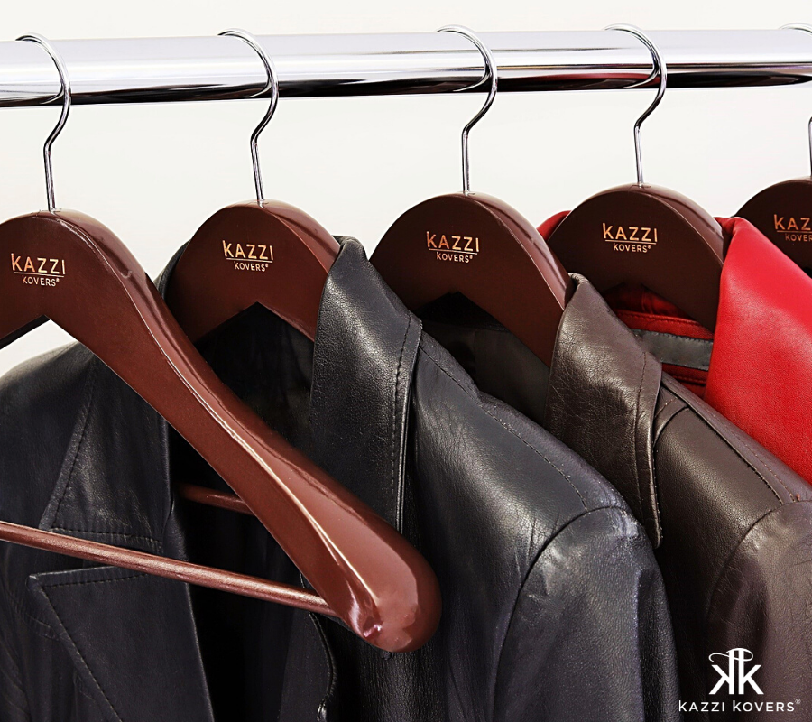 Kazzi Kovers walnut wooden hangers with leather jackets