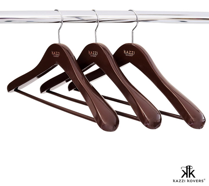 Stylish walnut coloured wooden hangers with contoured shoulders for extra garment support | Kazzi Kovers