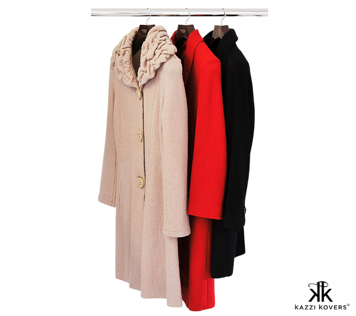 Full length view of wool coats hanging on wood coat hangers