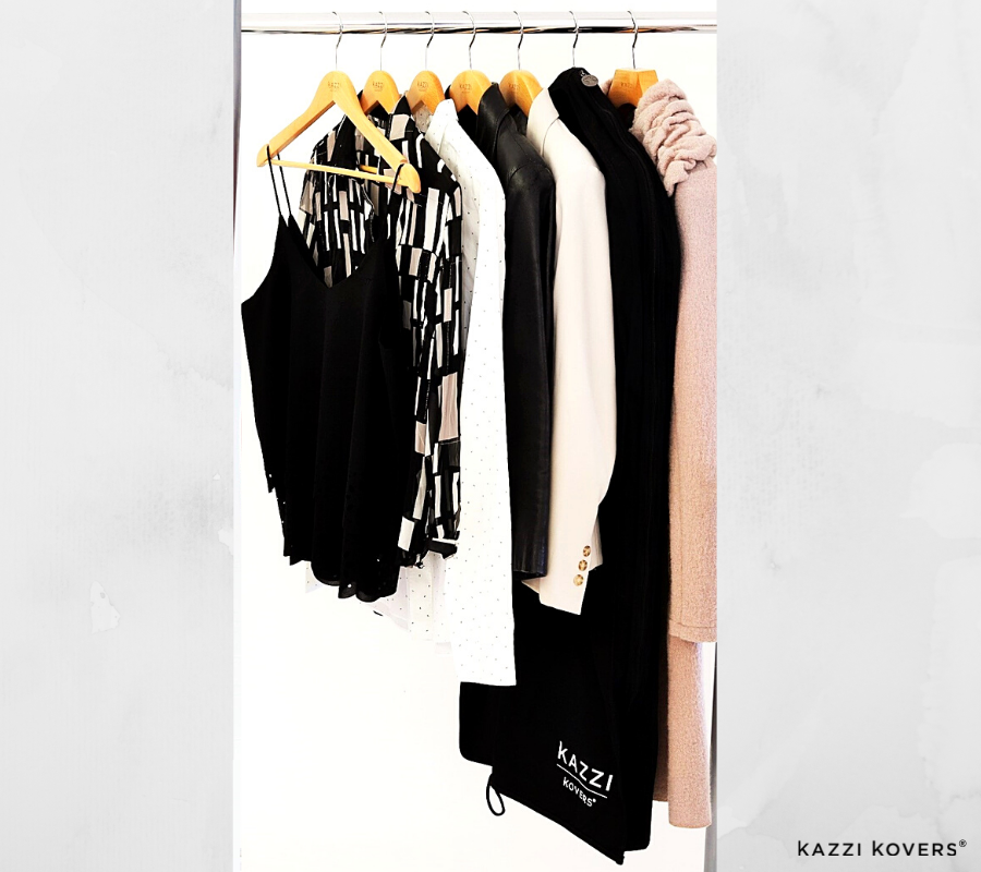 Various hanging garments with black garment bag and clip hangers