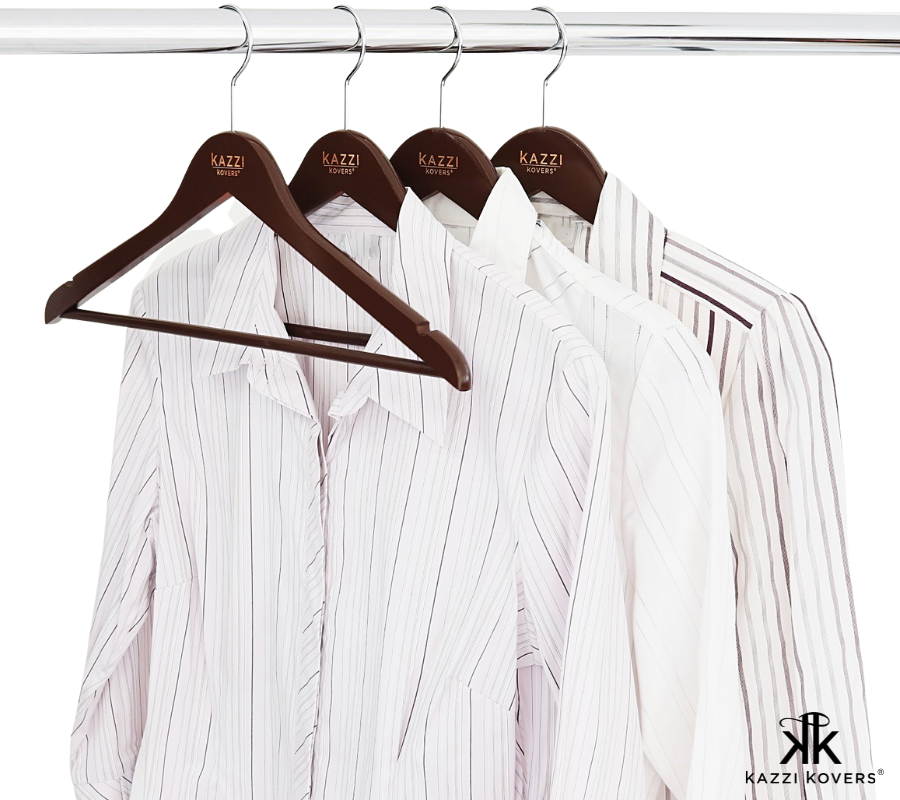 Long sleeve white shirts on stylish wooden hangers