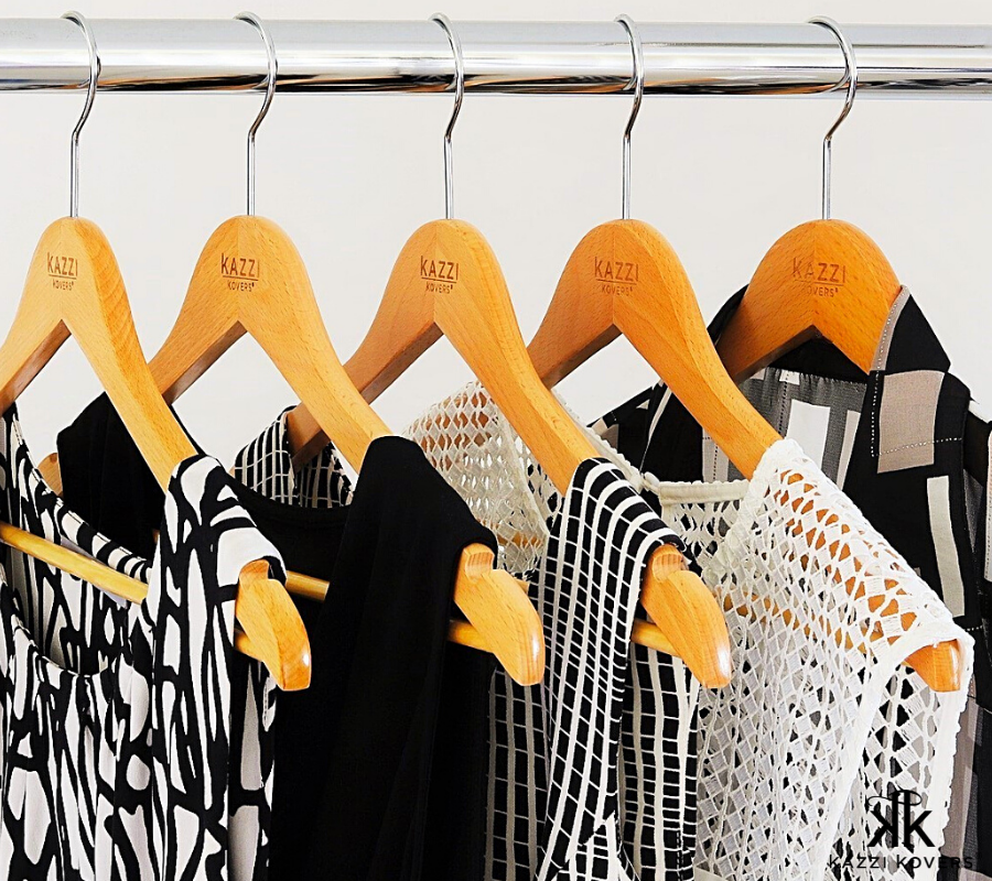 Classic wooden hangers with black and white tops