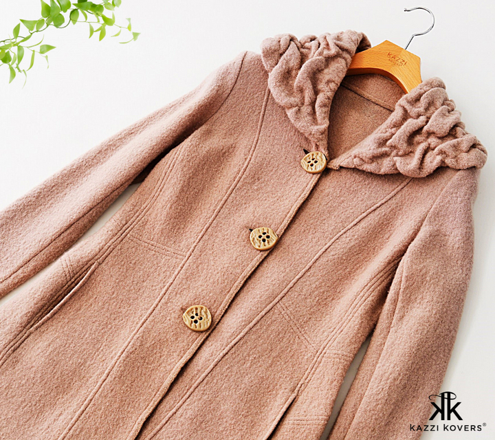 Beige wool coat with classy straight cut neckline wooden coat hanger