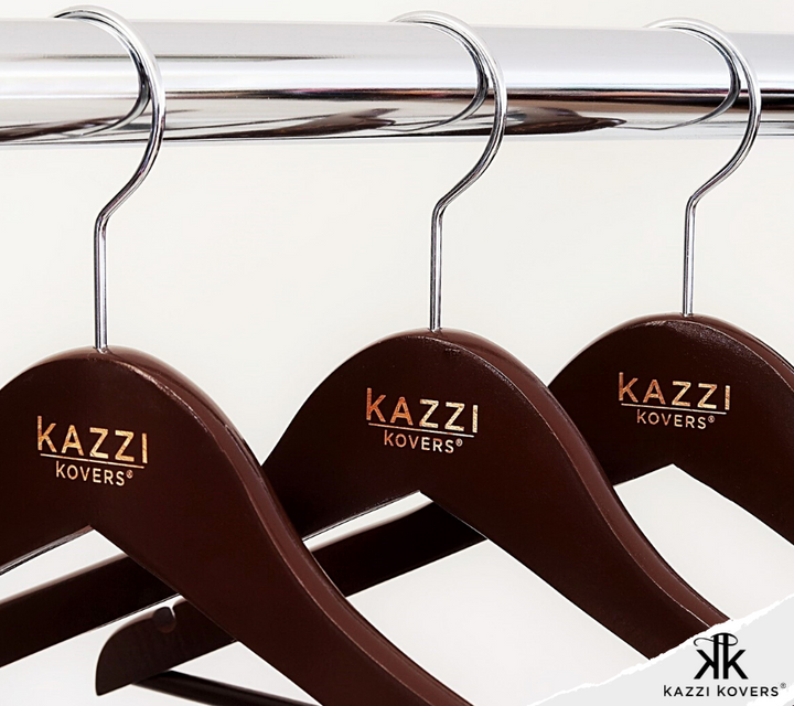 Engraved Kazzi Kovers logo on wooden walnut clothes hangers