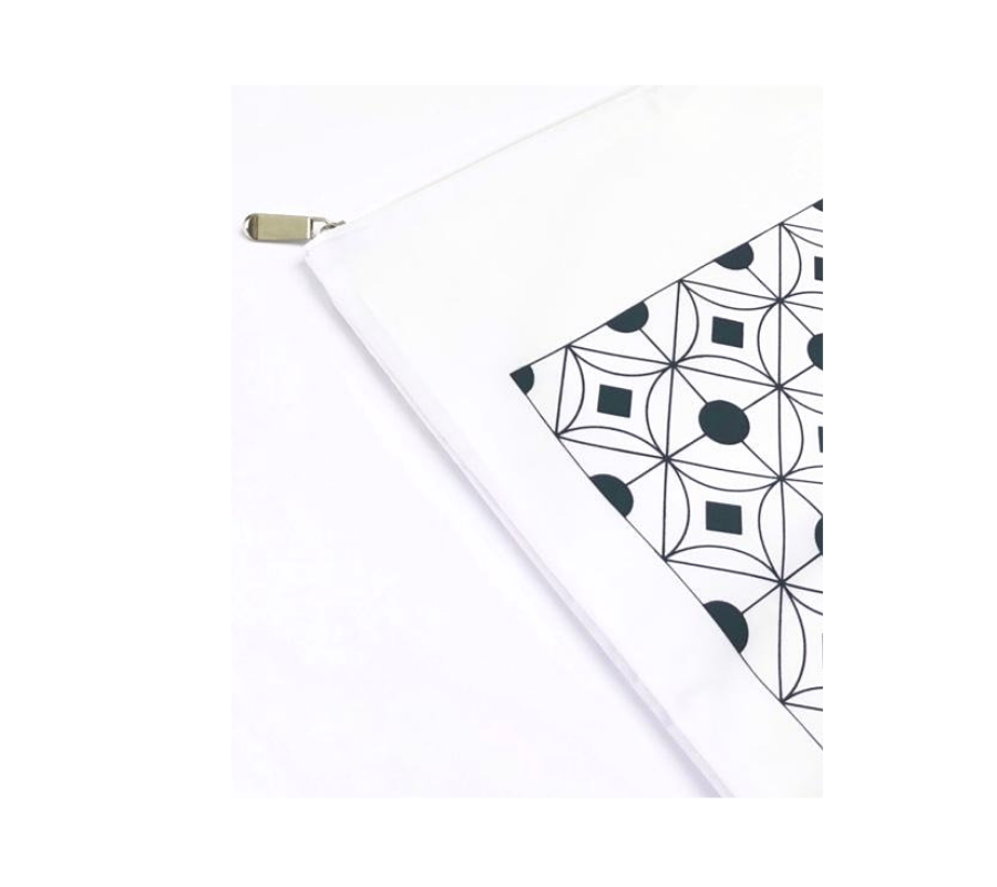 Corner view of geometric grey laundry bag