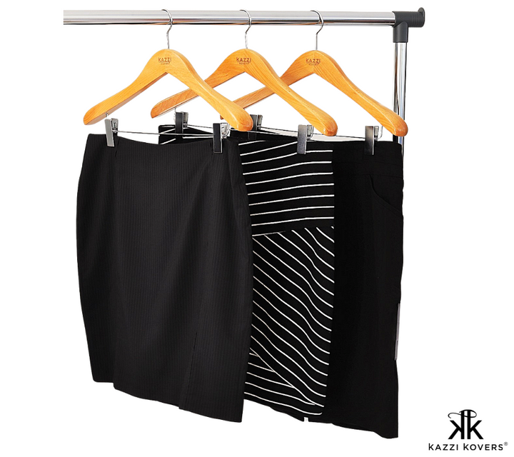 Black and white skirts neatly organised on clip hangers