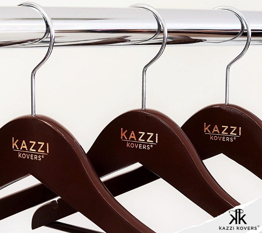 Walnut clothes hangers with engraved Kazzi Kovers logo