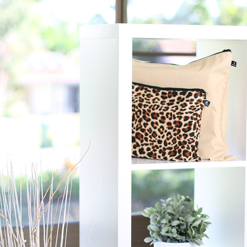 Latte Love (beige) & Zulu Leopard handbag dust bags displayed on shelf