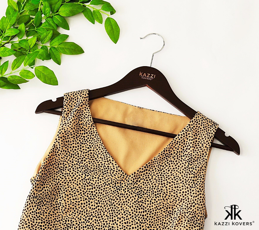 Walnut clothing hanger with with leopard print top