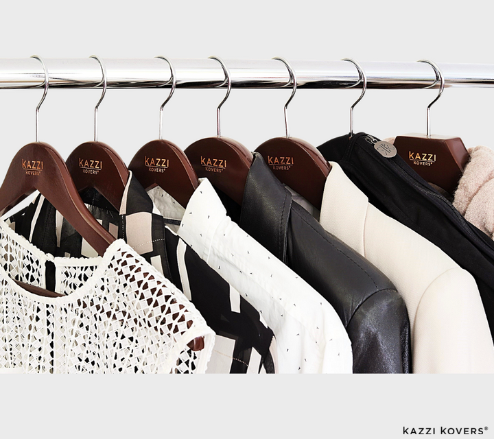 Various walnut Kazzi Kovers wooden hangers neatly organised on rack