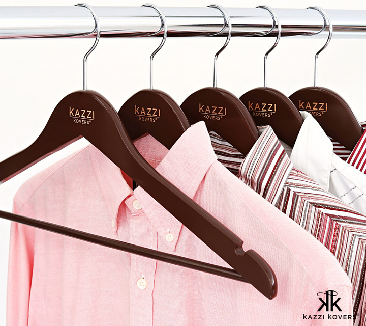 Kazzi Kovers engraved walnut hangers with pink and white shirts